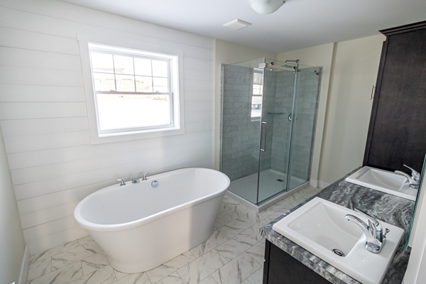 Master Bathroom with U-Tile Shower, Freestanding Tub and His and Her Sinks